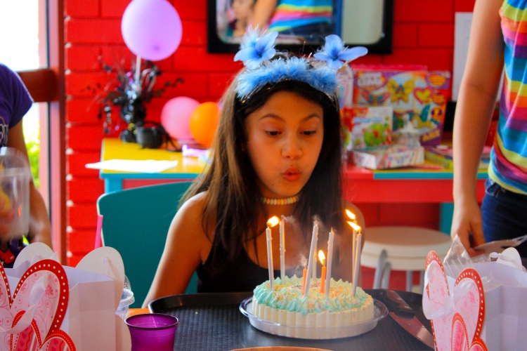 Gold Coast Kids Party Closeup blowing out Birthday Cake Candles